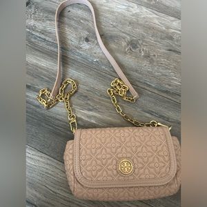 Tory Burch mini crossbody purse in blush pink with gold hardware.